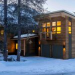 A home set in the trees on the hillside.
